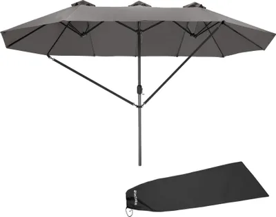 A large, dark gray, multi-sectioned patio umbrella is shown fully open against a white background. Below the umbrella, a folded, dark gray umbrella cover is also visible.