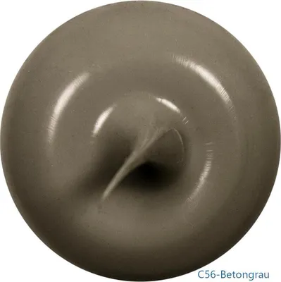 A close-up, top-down view of a dollop of grey sealant or caulk, with a swirl pattern in the center.