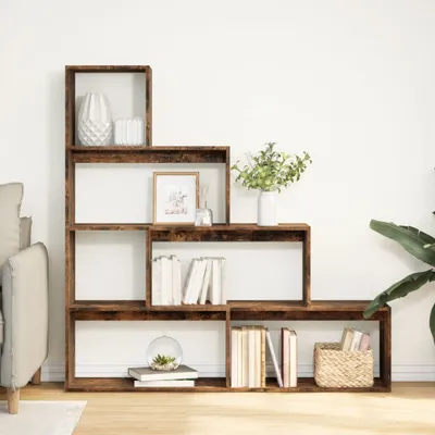 A multi-tiered wooden bookshelf filled with books, vases, and decorative items, set against a white wall.
