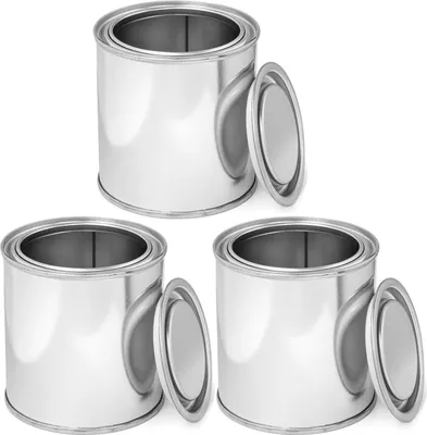 Three silver metal cans with open lids, arranged in a diagonal line.