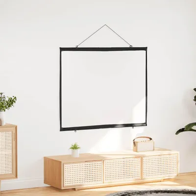 A white projection screen is hanging on a white wall above a wooden media console.