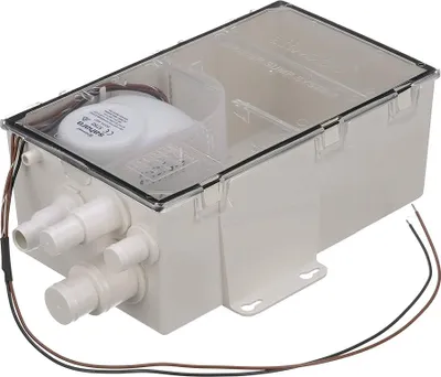 A white bilge pump with a clear lid, showing internal components and connections.