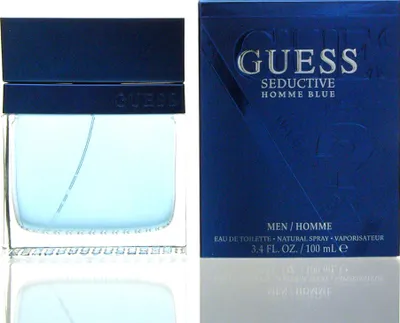 A bottle of Guess Seductive Homme Blue eau de toilette and its packaging are displayed side-by-side against a white background.