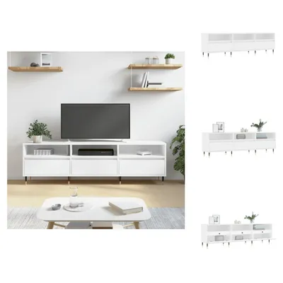 A white TV stand with a television on it, placed in a living room setting with shelves and a coffee table.