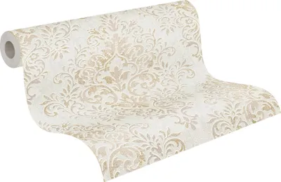 A roll of wallpaper with a damask pattern.