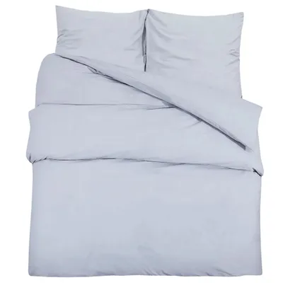 A neatly made bed with a duvet and two pillows, all in a light gray color.