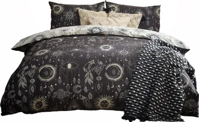 A bedding set with a celestial-themed pattern is displayed on a bed.