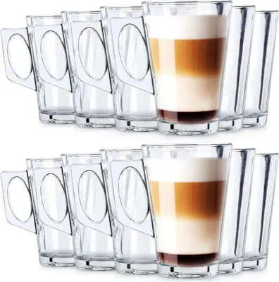 Two rows of clear glass tumblers, one with a layered beverage, against a white background.