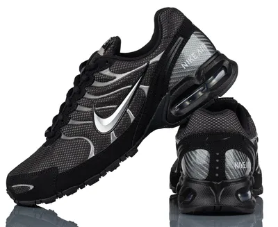 A pair of black Nike Air Max Torch 4 sneakers shown from a side and back angle against a white background.