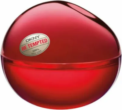 A red, spherical perfume bottle with a label.