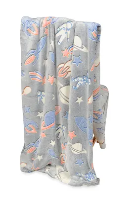 A folded blanket with a space-themed pattern.