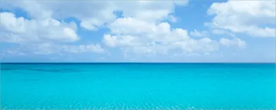 Produktbild von Wallario Poster - Sandstrand und blaues Meer, Kunstdruck Größe: 80 x 200 cm
