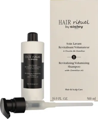 A bottle of shampoo and its box are displayed side-by-side on a white background.