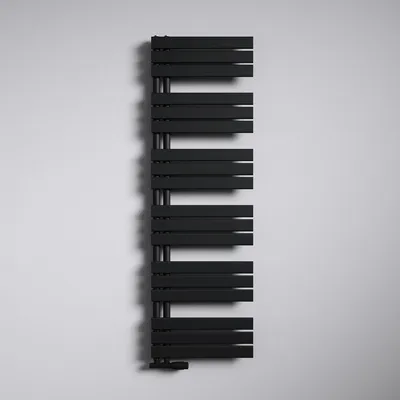 A black radiator mounted on a white wall.