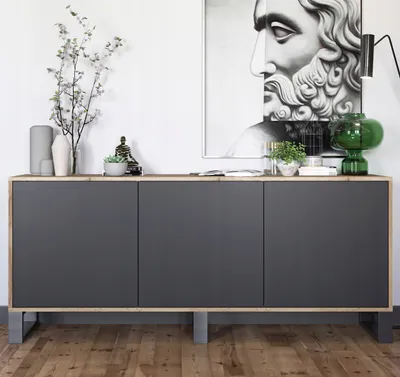 A modern sideboard with decorative items on top, placed on a wooden floor.