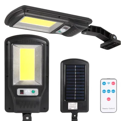 A collection of solar-powered LED lamps and a remote control, displayed against a white background.