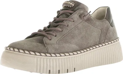A single gray women's sneaker with a platform sole is shown against a white background.