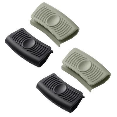 Four silicone pot holders are arranged in a diagonal pattern on a white background.