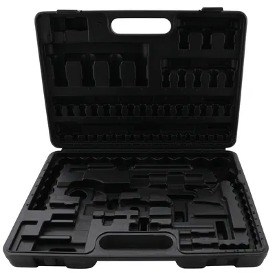 An open black tool case with custom-molded compartments for tools.