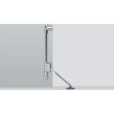 A metal flap stay mechanism is mounted on a wall.