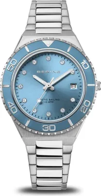 A Bering watch with a blue dial and silver metal band, shown from a front-facing diagonal angle.