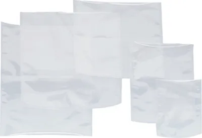 A collection of clear plastic vacuum seal bags of various sizes are arranged in a layered composition against a white background.