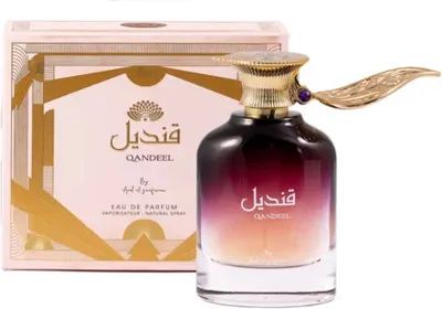 A perfume bottle and its box are displayed against a white background.