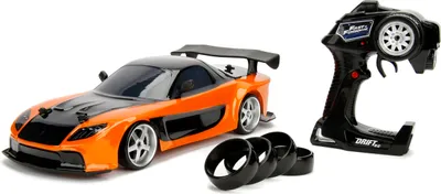 Produktbild von Jada Toys Fast & Furious RC Drift Mazda RX-7, RC Auto, ferngesteuertes Auto mit Funkfernsteuerung, Driftfunktion, Allradantrieb, 4 Ersatzreifen, USB Ladefunktion, inkl. Batterien, Maßstab 1:10, orange