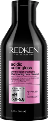 A black bottle of Redken Acidic Color Gloss Gentle Shampoo is shown against a white background.