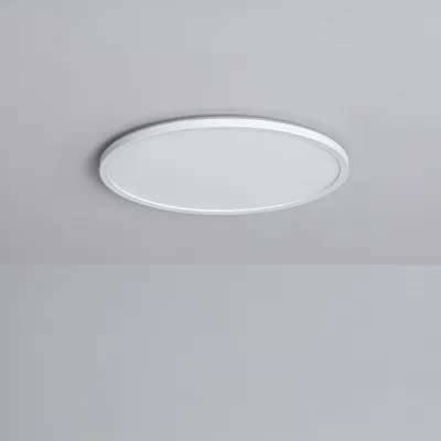 A white, round LED ceiling light is mounted on a light gray ceiling.