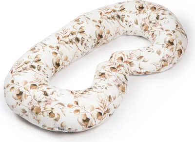 A large, U-shaped pillow with a floral pattern.