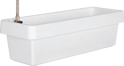 A white plastic planter box with a water level indicator inserted.