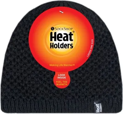 A black knitted beanie with a large circular tag attached.