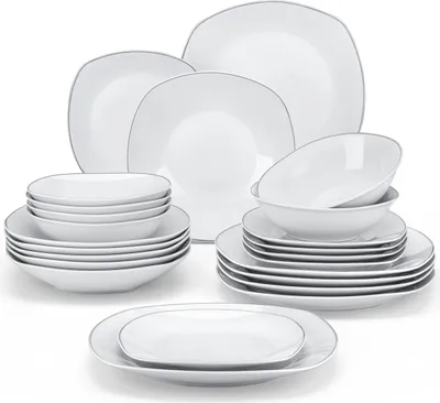 A collection of white ceramic plates and bowls with a thin silver rim, neatly stacked and arranged on a white background.