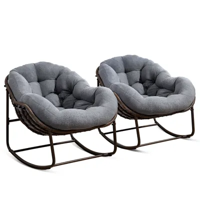 Two gray rocking chairs with thick cushions are shown against a white background.