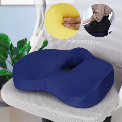 A blue seat cushion with a cut-out center is placed on a white office chair. In the upper left corner, a close-up shows a hand pressing into a yellow foam material, indicating its softness. In the upper right corner, a person is shown sitting on a chair, i