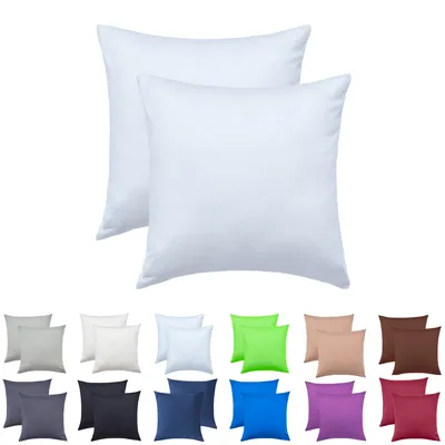 A collection of pillow covers in various colors, displayed in pairs below two white pillow covers.