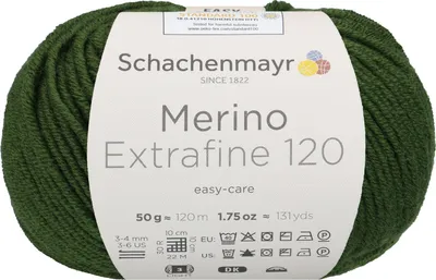 A ball of green yarn with a label wrapped around it.