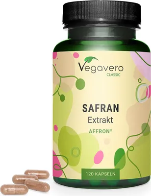 A bottle of Vegavero saffron extract capsules with a few capsules scattered in front of it.