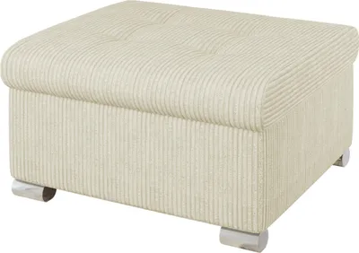 A cream-colored ottoman with a textured fabric and tufted top sits on a white background.