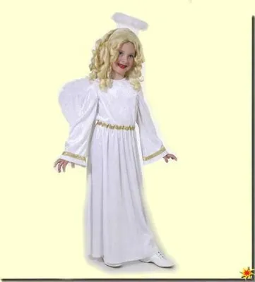A young girl dressed as an angel stands against a plain background.