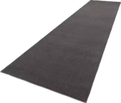 A dark gray runner rug is shown from a diagonal perspective against a white background.