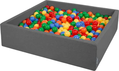 A dark gray ball pit filled with colorful plastic balls.