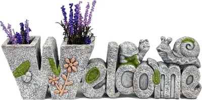 A decorative garden sign spelling out "WELCOME" with planters and animal figures.