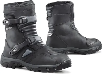 A pair of black Forma Adventure Low Dry motorcycle boots.
