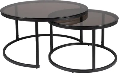 A set of two nesting coffee tables with round, smoked glass tops and black metal frames.