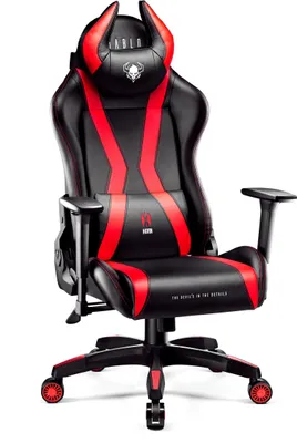 A black and red gaming chair with devil horns on the headrest.