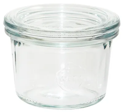 A clear glass jar with a ribbed lid.