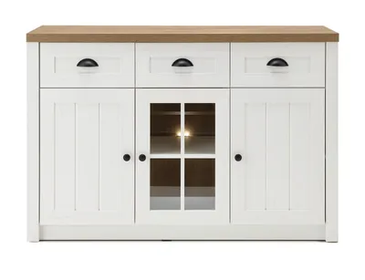 A white and light oak sideboard with three drawers and two cabinet doors, one of which has a glass pane.