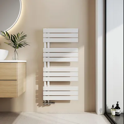 A modern bathroom setting with a white towel radiator mounted on a beige wall.